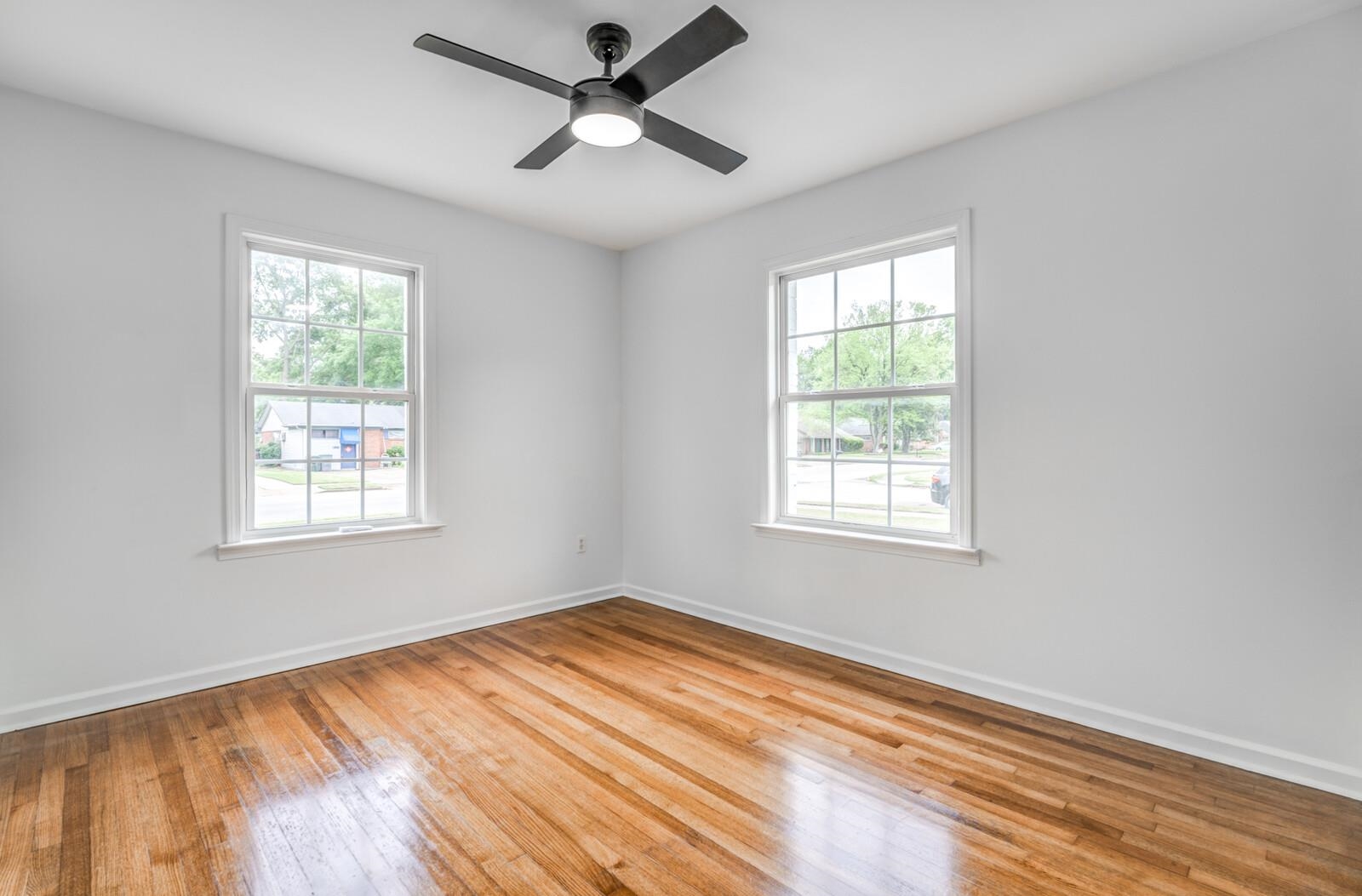 5600 Manley Road Memphis, TN 38120 - Photo 26 of 31 a view of empty room with wooden floor and fan