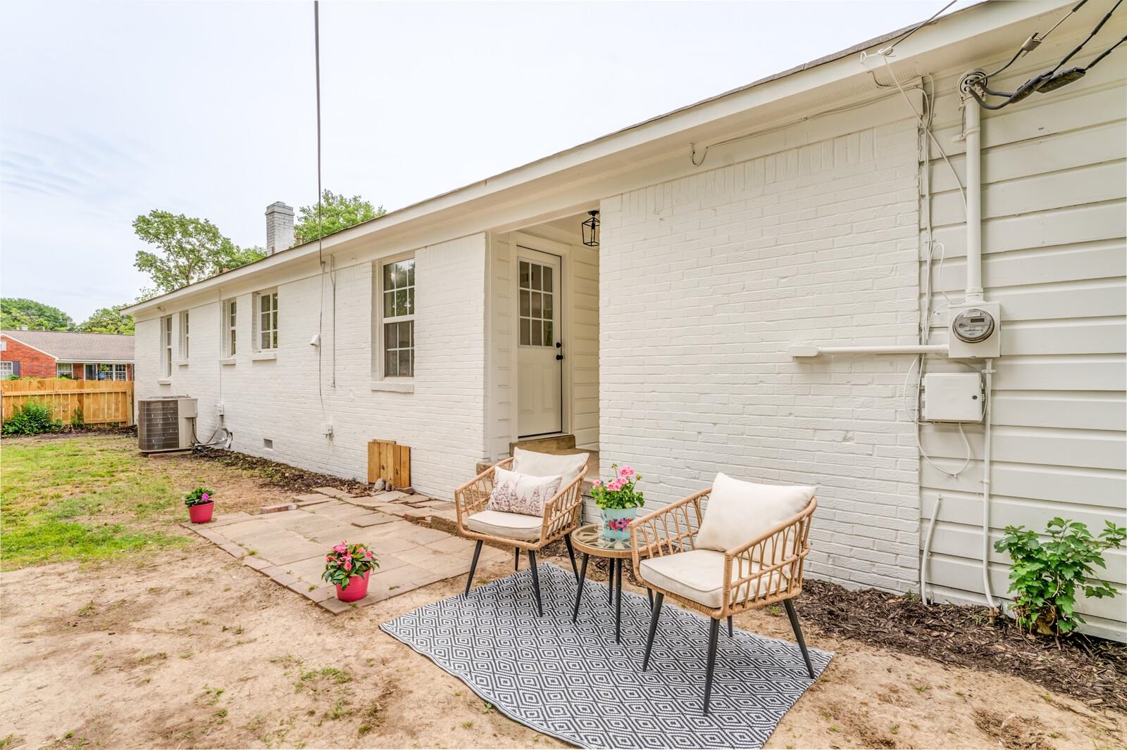 5600 Manley Road Memphis, TN 38120 - Photo 28 of 31 a backyard of a house with table and chairs
