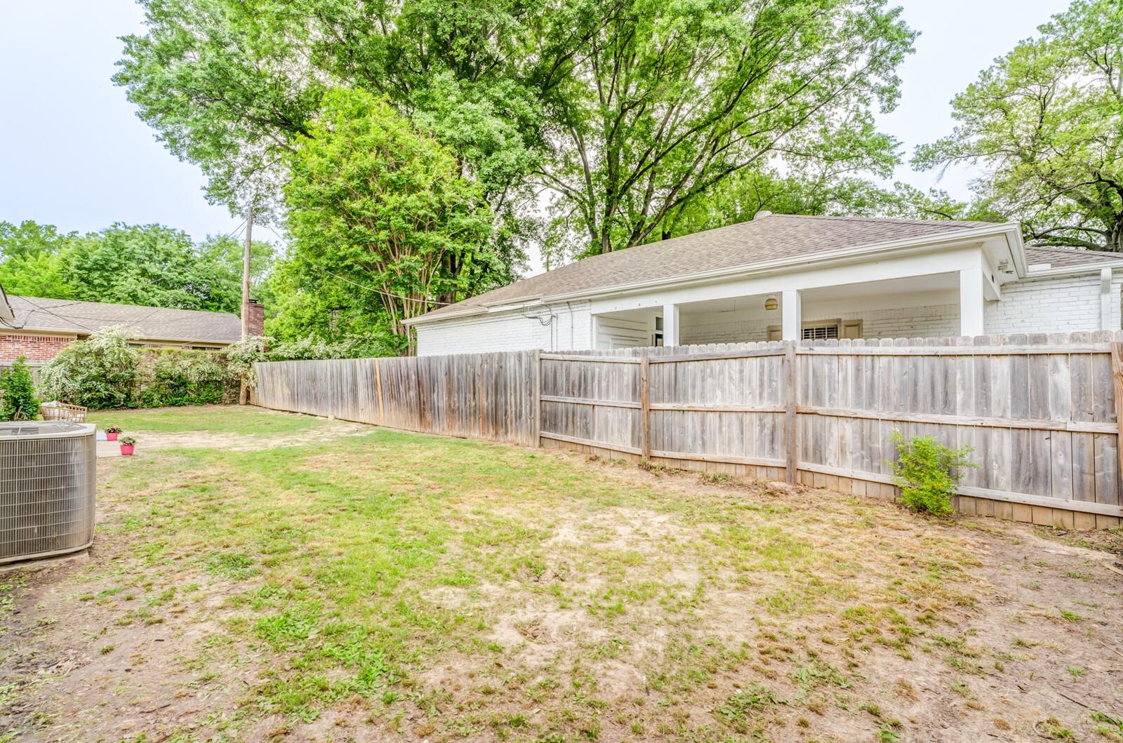 5600 Manley Road Memphis, TN 38120 - Photo 29 of 31 a view of a backyard with a small cabin