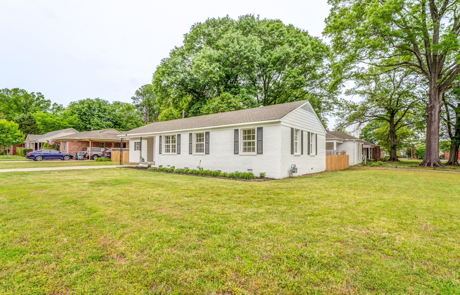 5600 Manley Road Memphis, TN 38120 - Photo 3 of 31 a front view of a house with a garden