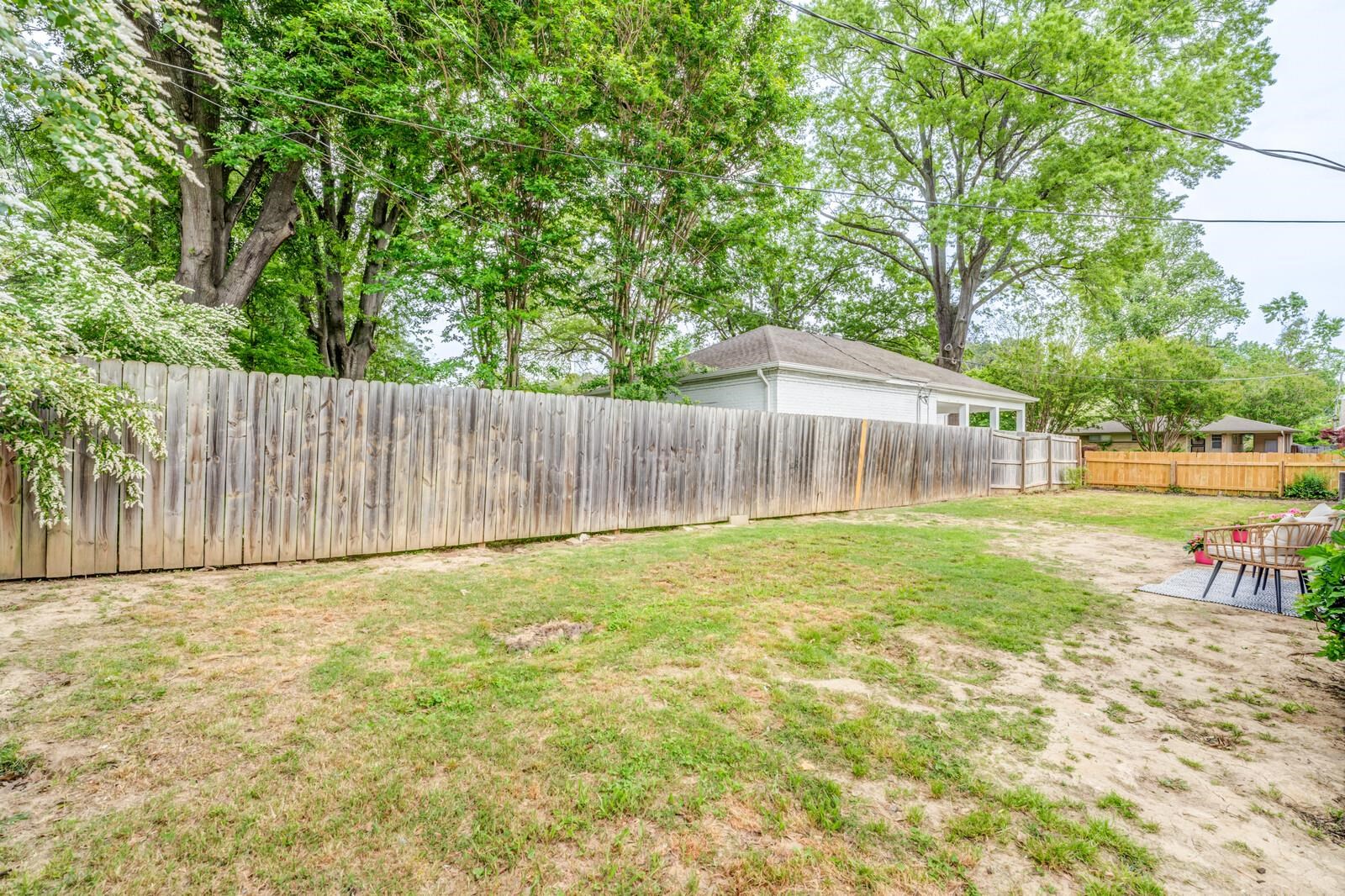 5600 Manley Road Memphis, TN 38120 - Photo 31 of 31 a backyard of a house with table and chairs