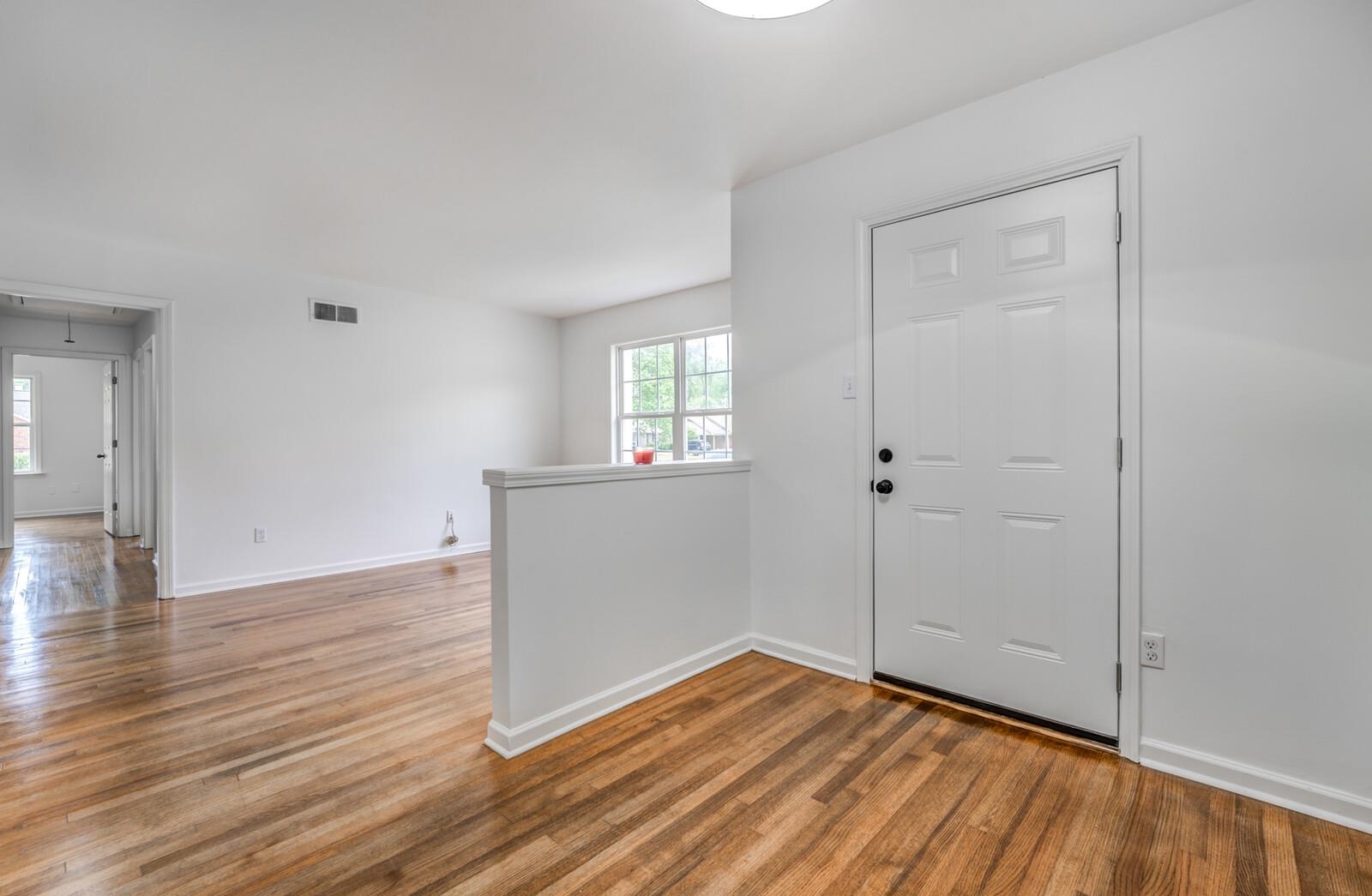5600 Manley Road Memphis, TN 38120 - Photo 5 of 31 wooden floor in an empty room with window