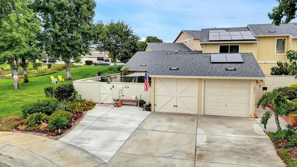 a view of a house with a back yard