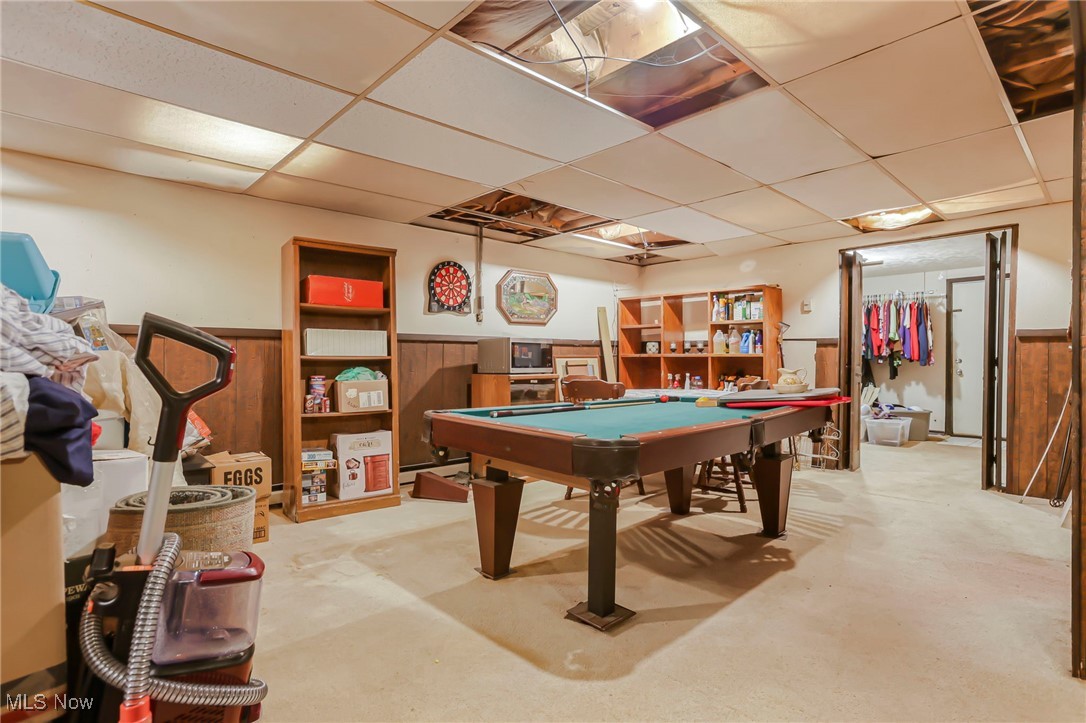232 McGill Road Vincent, OH 45784 - Photo 33 of 49 Recreation room featuring a drop ceiling, billiards table, wainscoting, concrete floors, and wood walls