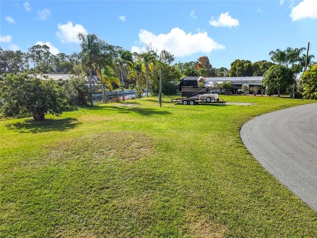 a swimming pool with lots of tress in front of it