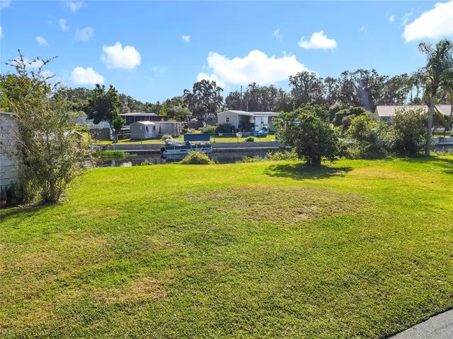 a view of a swimming pool with a table and chairs
