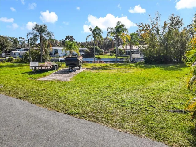 a view of a swimming pool with a yard