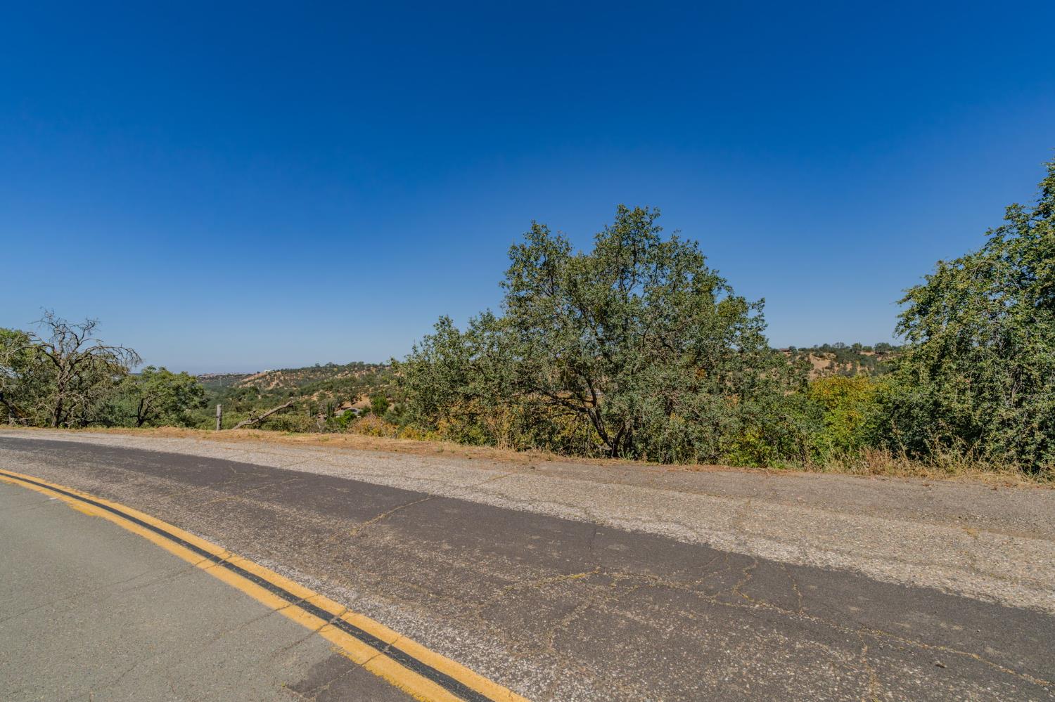 3721 Dunn Road Valley Springs, CA 95252 - Photo 3 of 14 a view of a road with a trees in the background