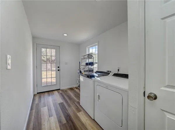 a kitchen with wooden floors and sink