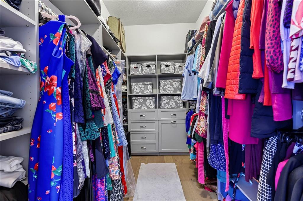3445 Stratford Road Northeast, Unit 3105 Atlanta, GA 30326 - Photo 24 of 47 a view of walk in closet with clothes and shoes