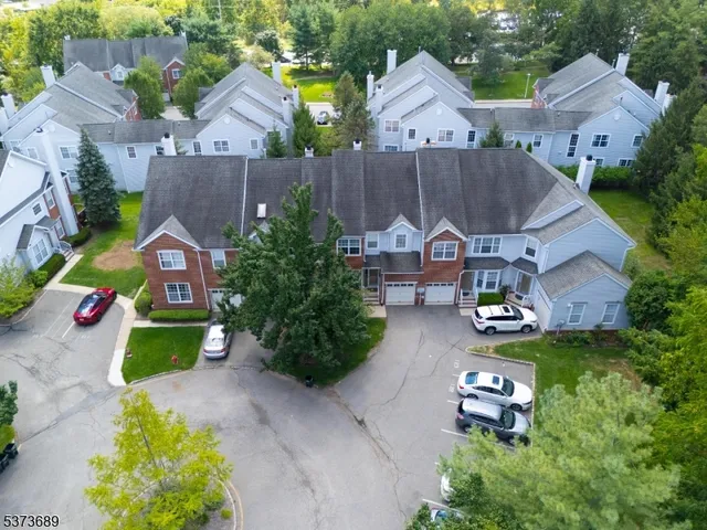an aerial view of a house with swimming pool yard and outdoor seating