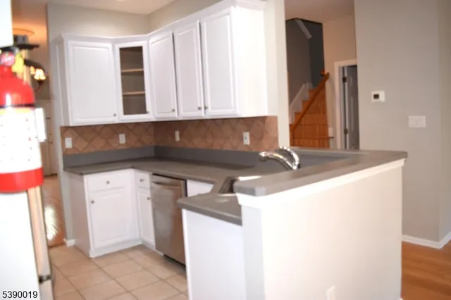 a kitchen with a sink and cabinets