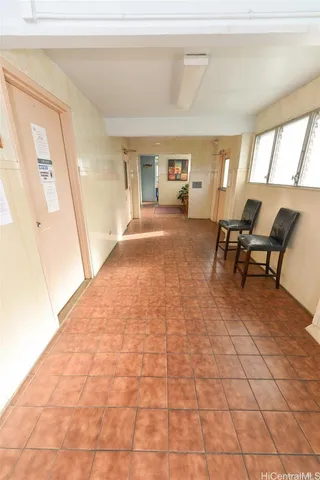 a view of a livingroom with furniture and windows