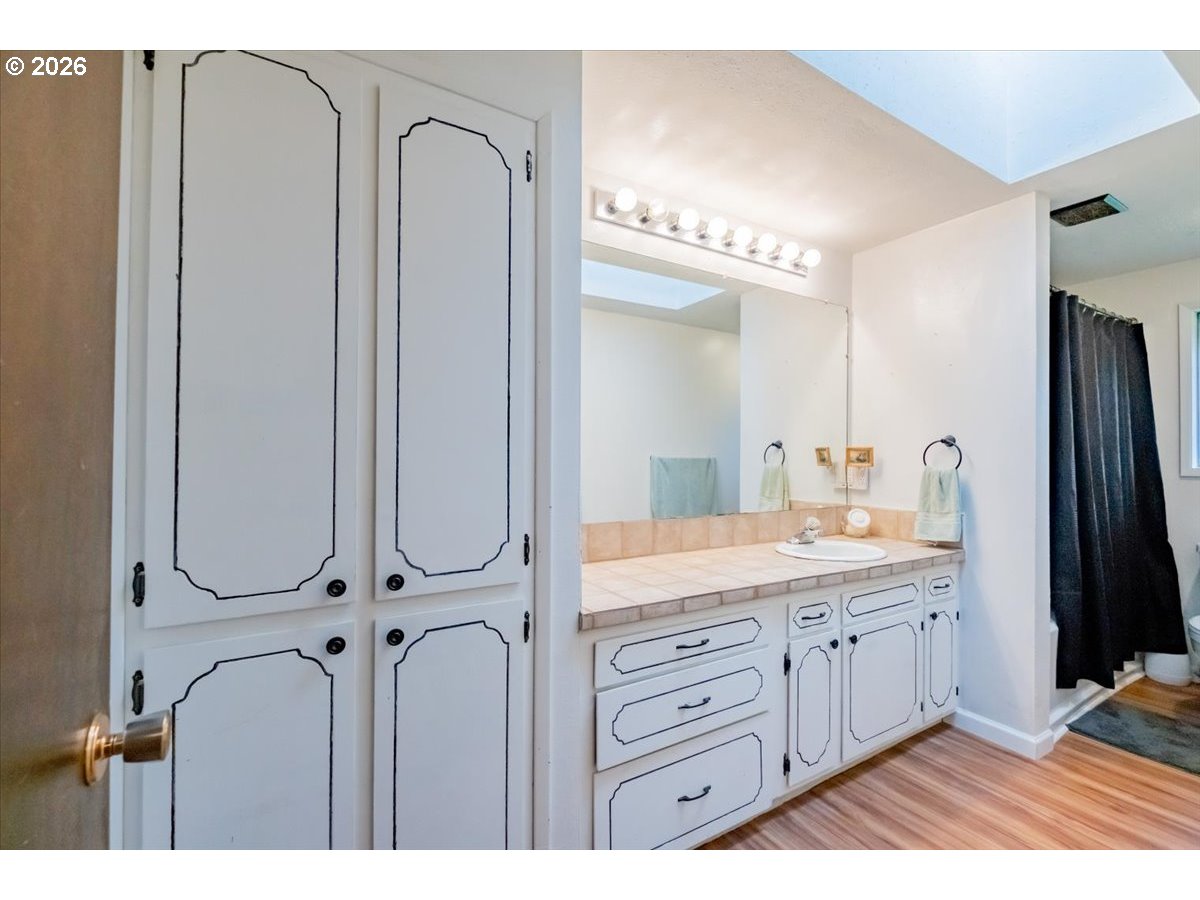 1360 Sunset Lane Sweet Home, OR 97386 - Photo 13 of 26 a bathroom with a double vanity sink and a mirror