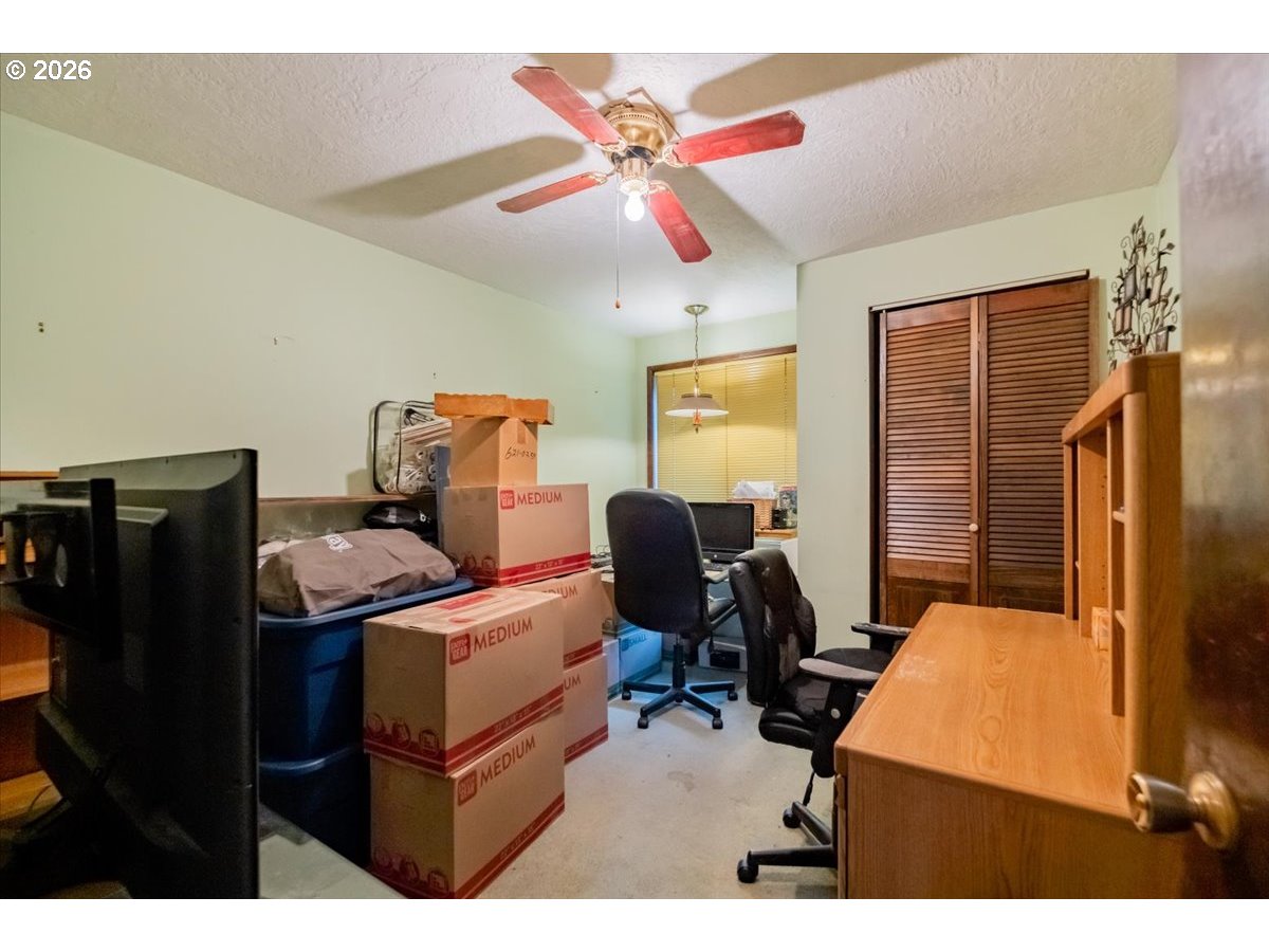 1360 Sunset Lane Sweet Home, OR 97386 - Photo 19 of 26 a view of a workspace with furniture and a window