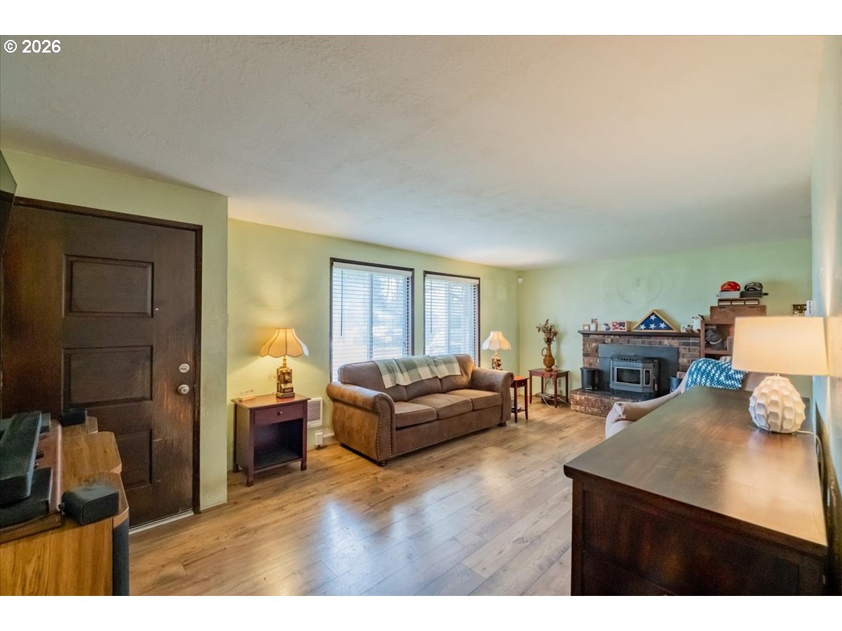 1360 Sunset Lane Sweet Home, OR 97386 - Photo 2 of 26 a living room with furniture and a flat screen tv