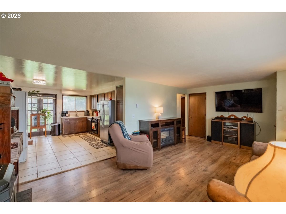 1360 Sunset Lane Sweet Home, OR 97386 - Photo 3 of 26 a living room with furniture and a flat screen tv