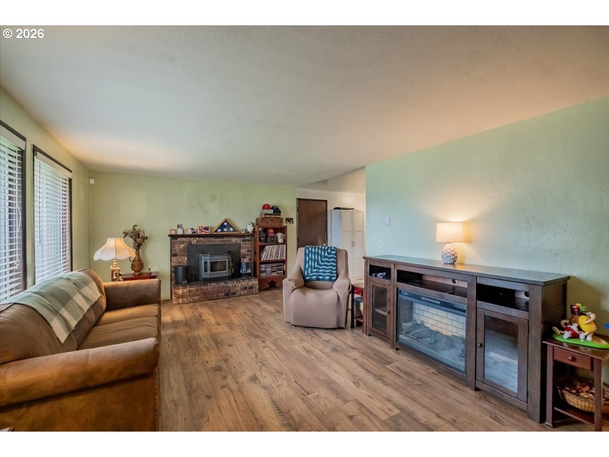 1360 Sunset Lane Sweet Home, OR 97386 - Photo 5 of 26 a living room with furniture and wooden floor