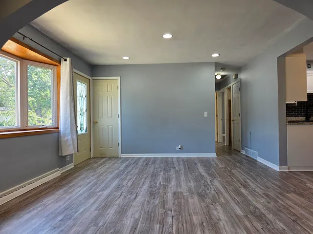 a view of a hallway with a chandelier