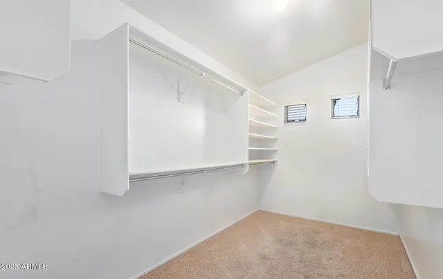 a view of an empty walk in closet