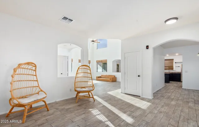 a view of a workspace with furniture and staircase