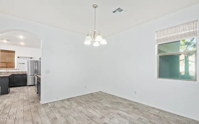 a view of a kitchen with a sink and a window