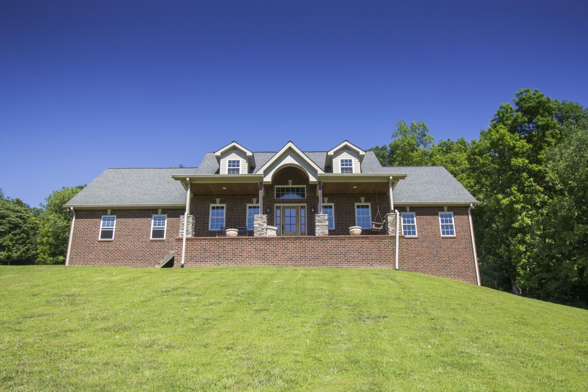 57 Lakeside Drive Carthage, TN 37030 - Photo 1 of 34 a front view of a house with a yard and garage