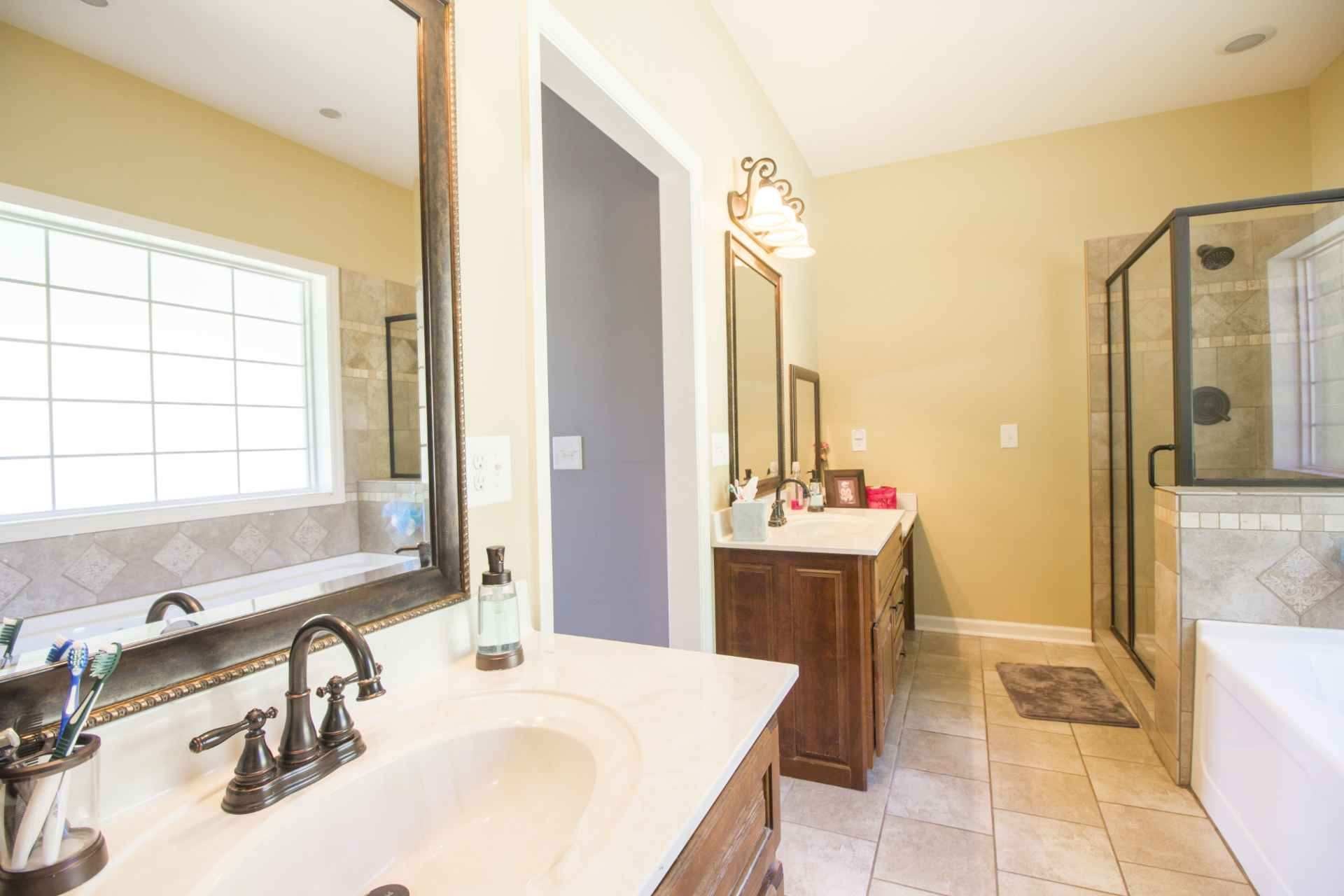 57 Lakeside Drive Carthage, TN 37030 - Photo 23 of 34 a bathroom with a tub sink and mirror