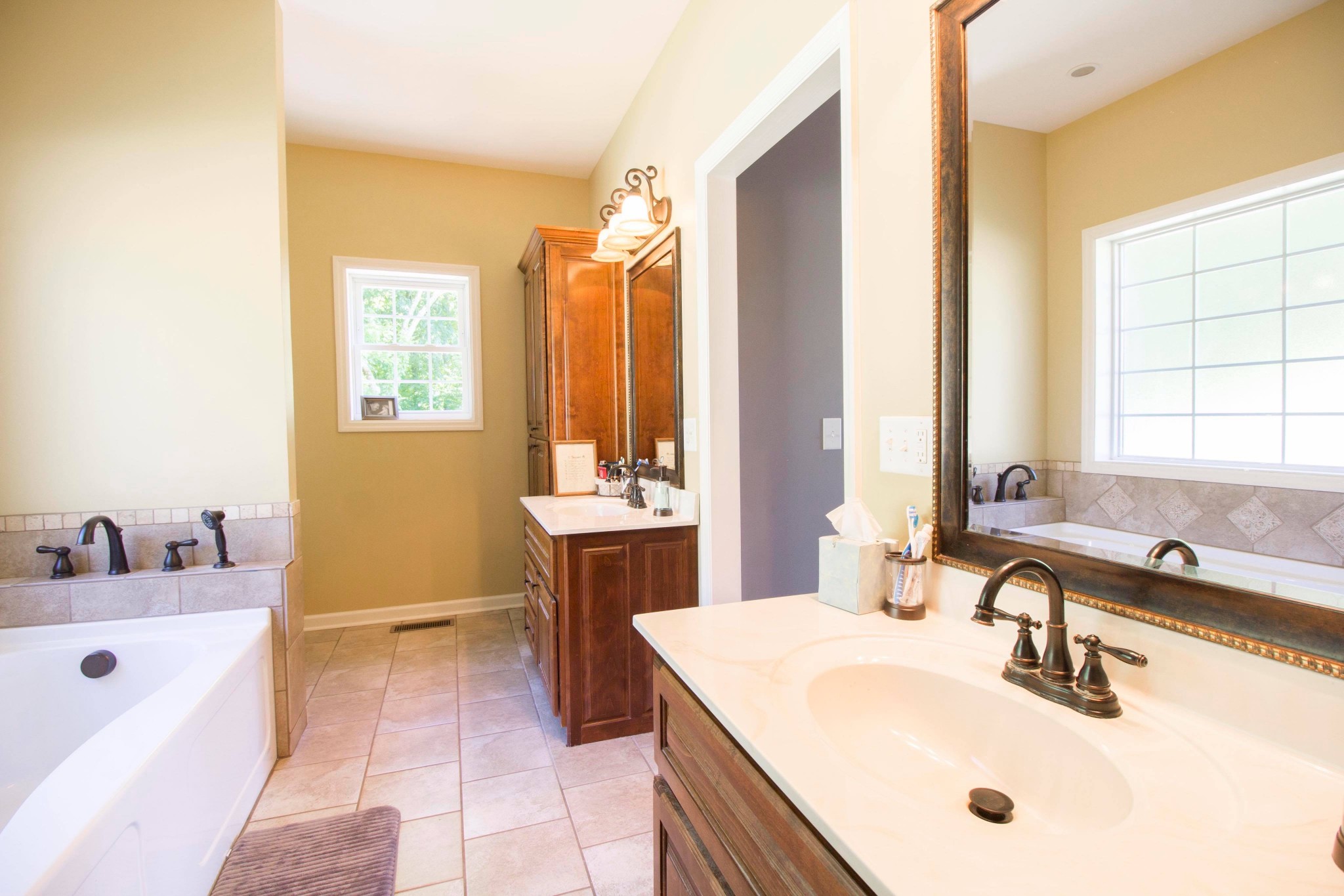 57 Lakeside Drive Carthage, TN 37030 - Photo 26 of 34 a bathroom with a tub sink and mirror