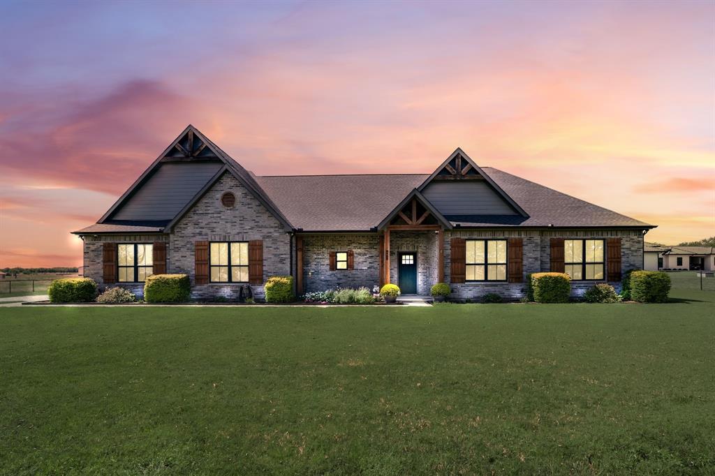 7739 Borth Road Sanger, TX 76266 - Photo 1 of 39 Craftsman-style home featuring a lawn, covered porch, and brick siding