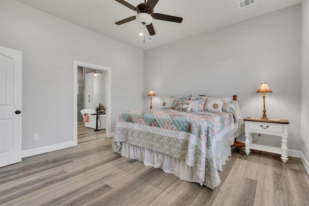 7739 Borth Road Sanger, TX 76266 - Photo 15 of 39 Bedroom featuring light wood-style floors, ceiling fan, and recessed lighting