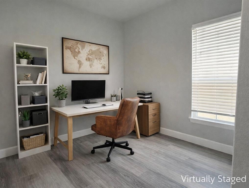 7739 Borth Road Sanger, TX 76266 - Photo 21 of 39 AI staged Flex Office or Nursery space featuring light wood-style floors, desk, chair and bookcase