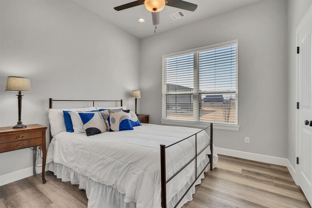 7739 Borth Road Sanger, TX 76266 - Photo 22 of 39 Bedroom featuring a ceiling fan, light wood-style floors, and recessed lighting