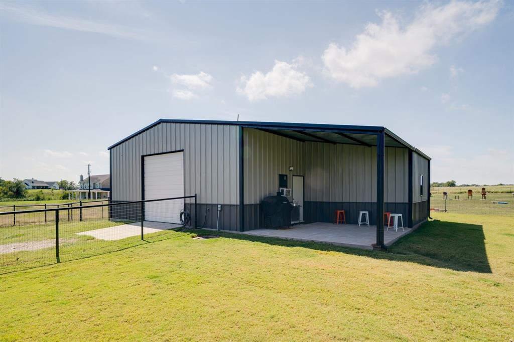 7739 Borth Road Sanger, TX 76266 - Photo 29 of 39 View of pole building featuring driveway and a view of rural / pastoral area