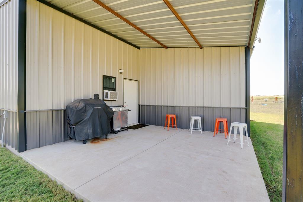 7739 Borth Road Sanger, TX 76266 - Photo 30 of 39 View of patio featuring a grill area off of pole bldg.