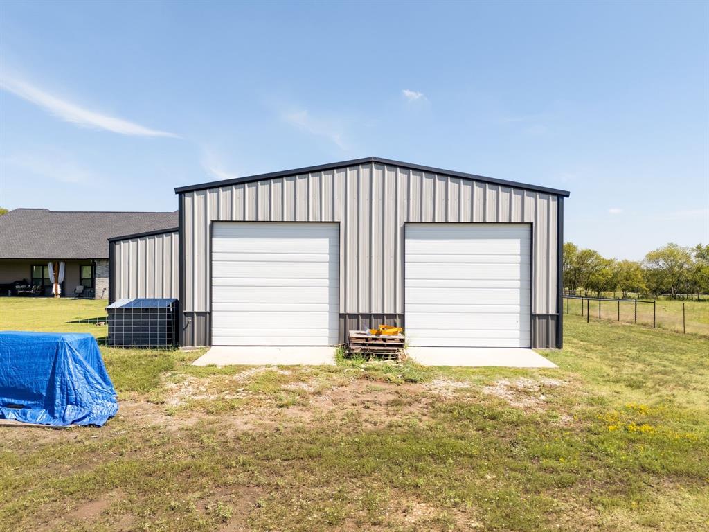 7739 Borth Road Sanger, TX 76266 - Photo 31 of 39 Back view of out building with two doors for equipment storage