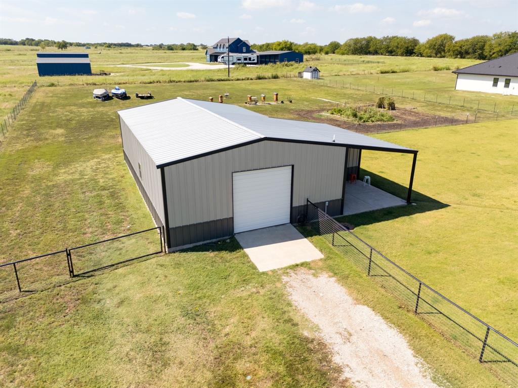 7739 Borth Road Sanger, TX 76266 - Photo 35 of 39 View of pole building featuring a view of rural / pastoral area, dirt driveway, and a gate
