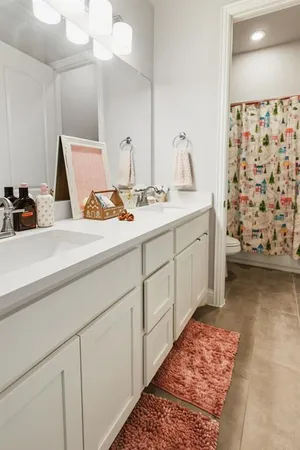 a room with a sink and a mirror