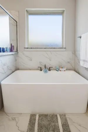 a bathroom with a bathtub and a sink