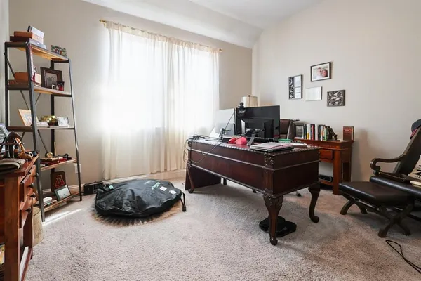 a room with a desk and a workspace