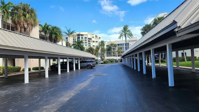 a view of a house with backyard porch and sitting area