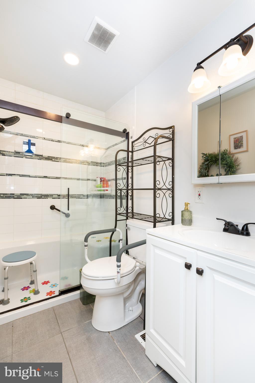 913 Aldon Road Claymont, DE 19703 - Photo 15 of 26 a bathroom with a sink a toilet and a mirror