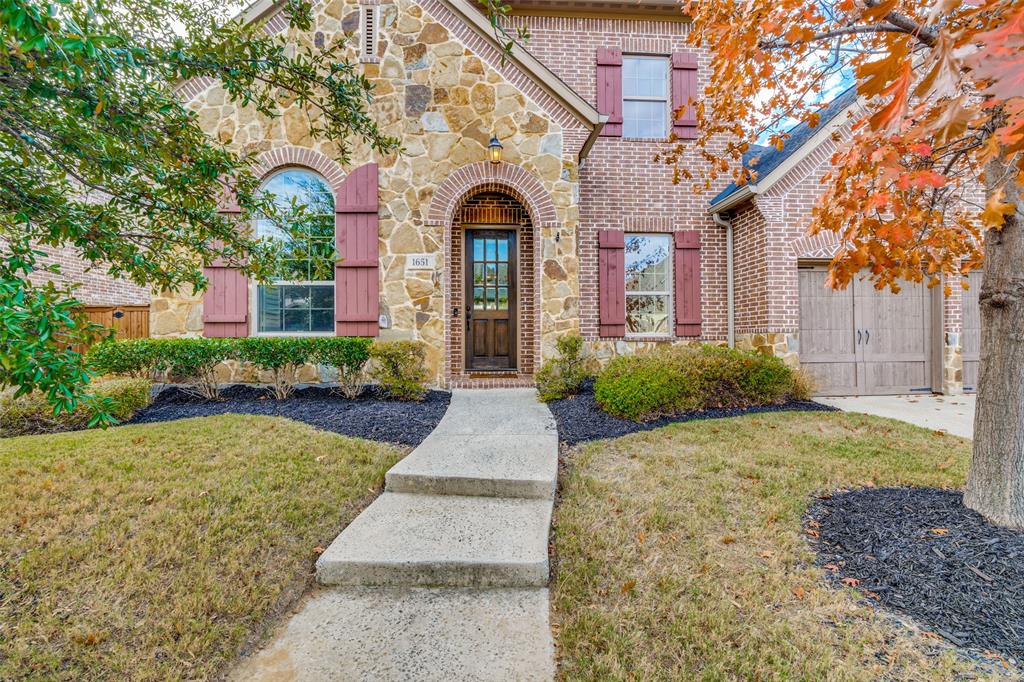 1651 Saddle Tree Road Frisco, TX 75036 - Photo 1 of 1 a front view of a house with garden