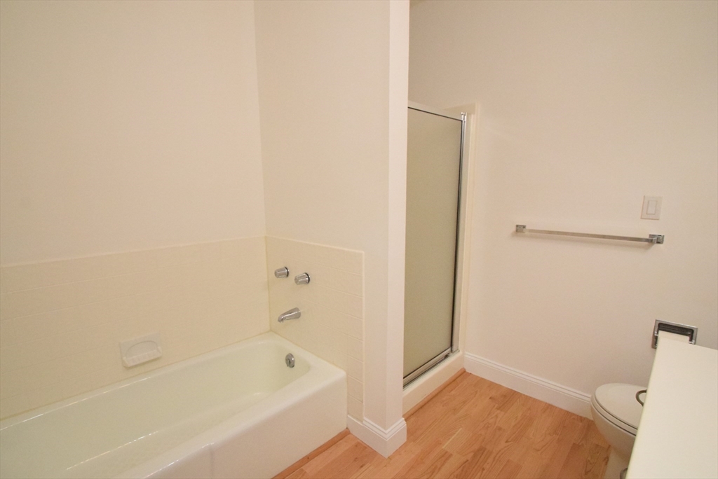 52 Kates Path, Unit 52 Yarmouth, MA 02675 - Photo 25 of 33 a bathroom with a bathtub and a toilet