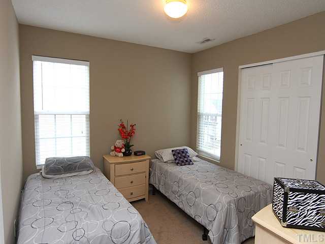 4461 Snowcrest Lane Raleigh, NC 27616 - Photo 12 of 25 a bedroom with a bed and a window
