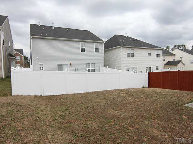 4461 Snowcrest Lane Raleigh, NC 27616 - Photo 15 of 25 a view of a house with a backyard