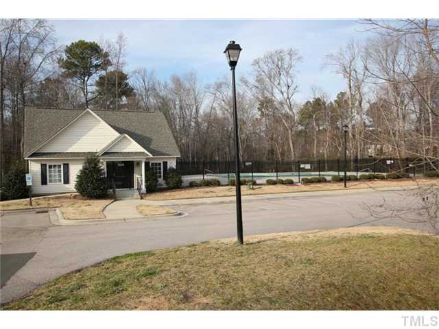 4461 Snowcrest Lane Raleigh, NC 27616 - Photo 16 of 25 a front view of a house with a yard