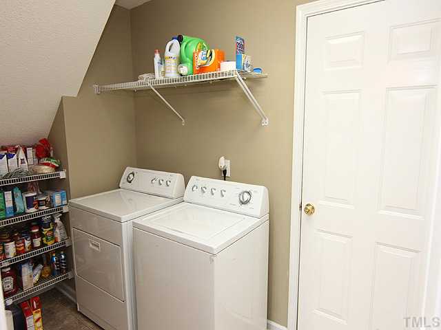 4461 Snowcrest Lane Raleigh, NC 27616 - Photo 7 of 25 a utility room with dryer and washer