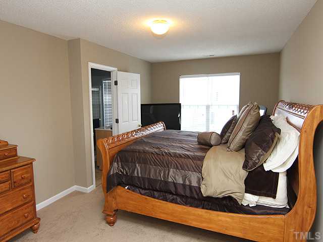 4461 Snowcrest Lane Raleigh, NC 27616 - Photo 9 of 25 a bedroom with a bed and window