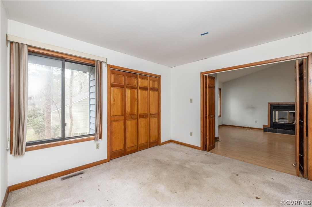 3102 Spreading Oak Road Midlothian, VA 23112 - Photo 13 of 25 a view of a livingroom with wooden floor and a ceiling fan
